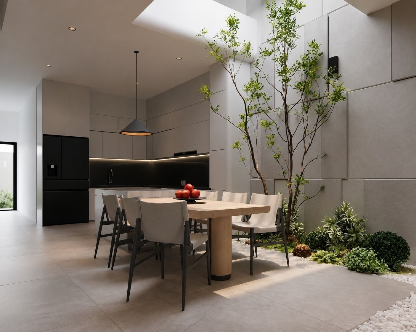 Dining area beside the indoor garden with gray stone wall panels